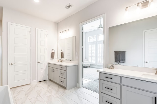 bathroom featuring ceiling fan and vanity