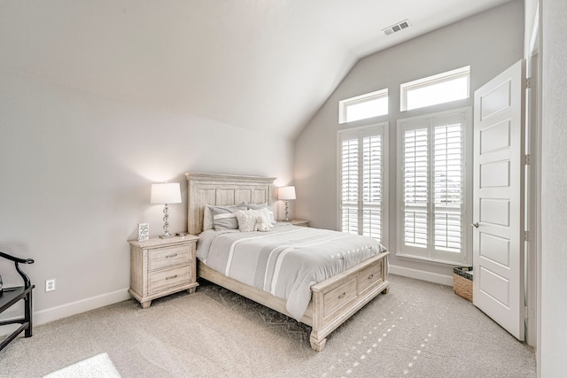 carpeted bedroom featuring vaulted ceiling