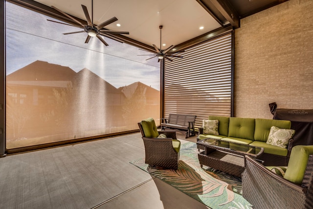 view of patio / terrace featuring ceiling fan and an outdoor living space