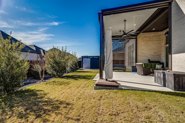 view of yard featuring an outdoor hangout area, a patio, and ceiling fan