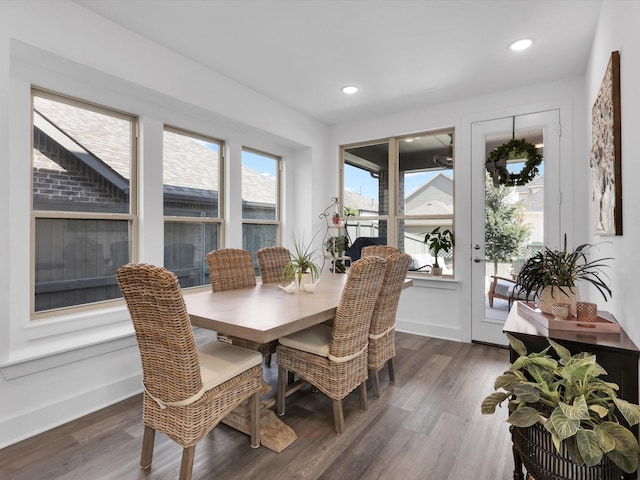 dining space featuring recessed lighting, wood finished floors, and baseboards