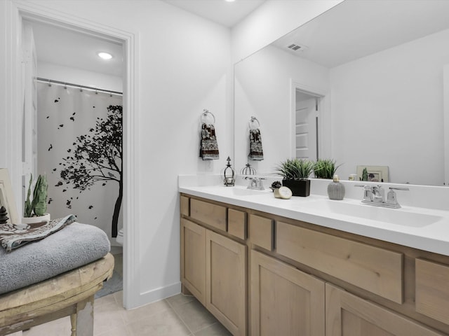 bathroom with vanity and tile patterned floors