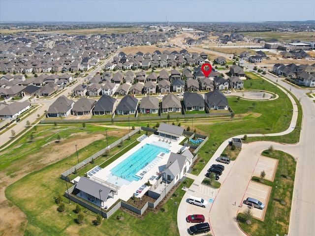 birds eye view of property with a residential view