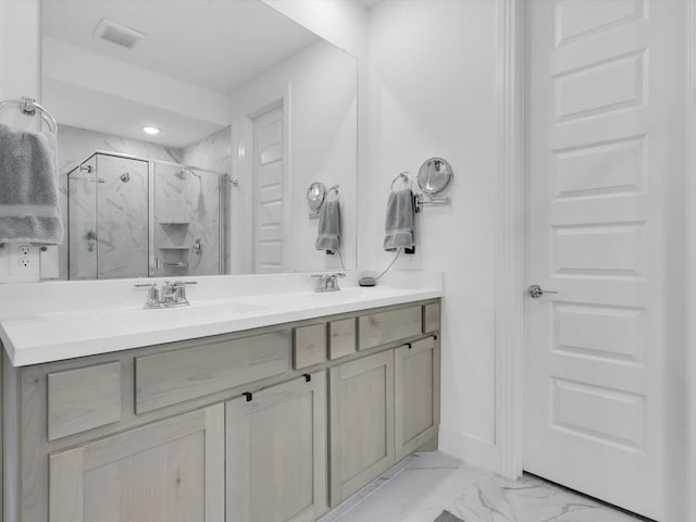 bathroom with visible vents, marble finish floor, a sink, a marble finish shower, and double vanity