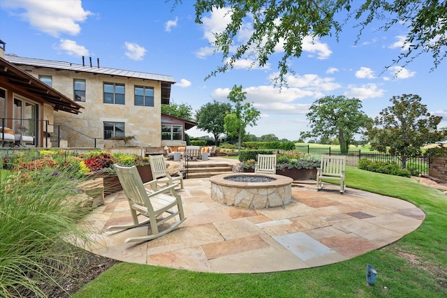 view of patio featuring an outdoor fire pit