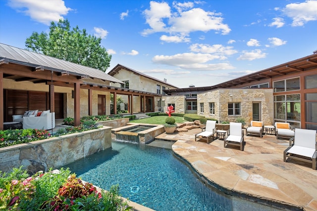 view of pool with an in ground hot tub and a patio area