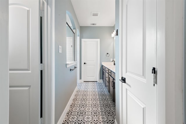 bathroom featuring tile patterned floors and vanity