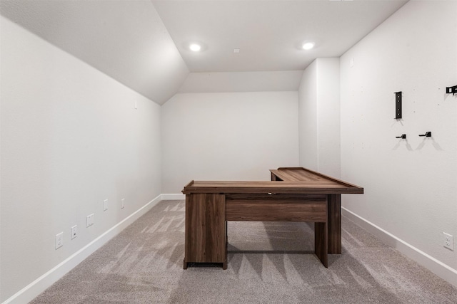 office featuring lofted ceiling and carpet