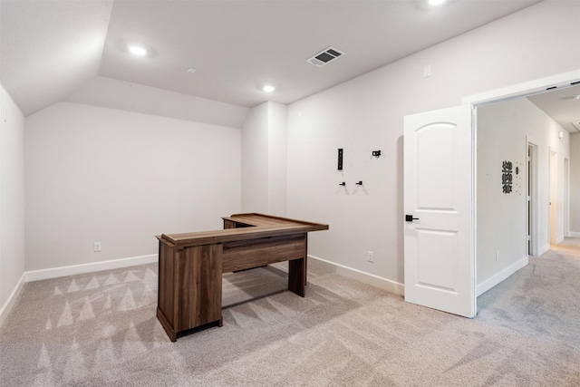 office space featuring lofted ceiling and light carpet