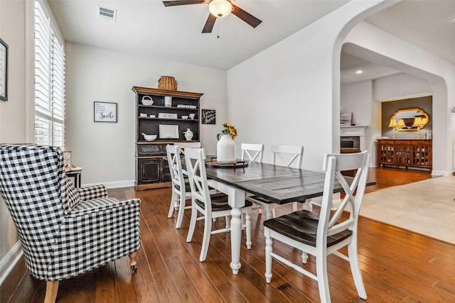 dining room with hardwood / wood-style flooring and ceiling fan