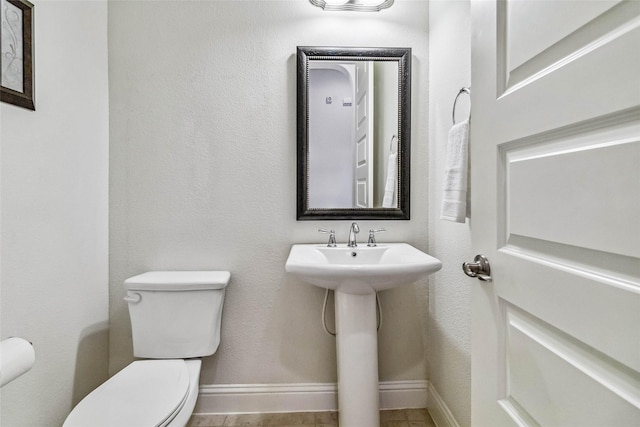 bathroom with sink and toilet