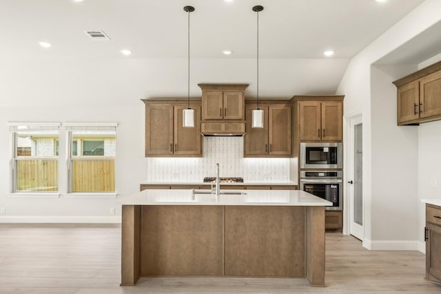3350 Blazing Star Dr, Crandall, TX 75114 - kitchen with stainless steel appliances, light wood finished floors, decorative backsplash, a sink, and recessed lighting