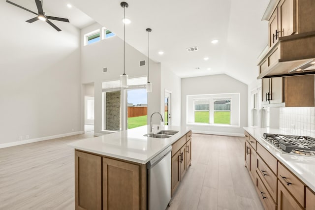 3350 Blazing Star Dr, Crandall, TX 75114 - kitchen with a sink, appliances with stainless steel finishes, light wood-style floors, baseboards, and recessed lighting