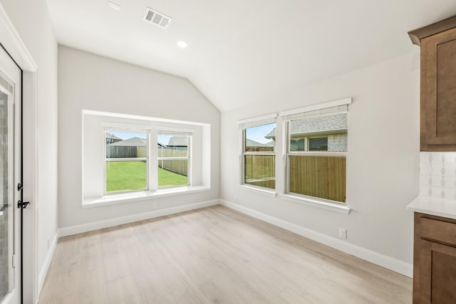 3350 Blazing Star Dr, Crandall, TX 75114 - unfurnished dining area featuring light wood-type flooring, lofted ceiling, baseboards, and recessed lighting