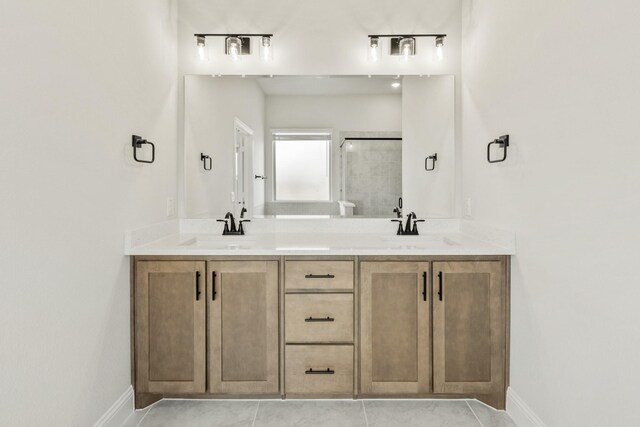 3350 Blazing Star Dr, Crandall, TX 75114 - bathroom featuring baseboards, double vanity, a stall shower, and tile patterned flooring