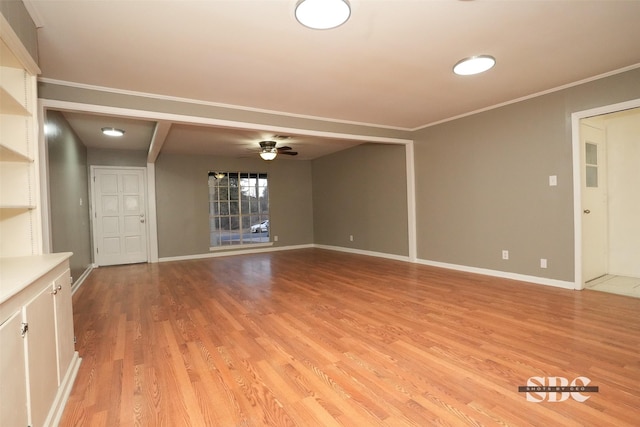 unfurnished living room featuring ornamental molding, light hardwood / wood-style floors, and ceiling fan