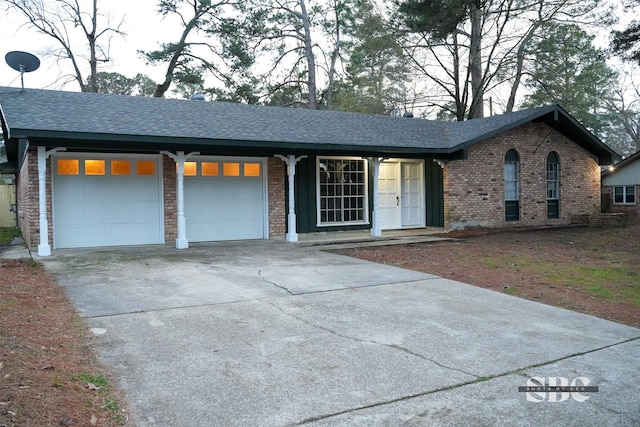 ranch-style house featuring a garage