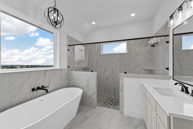 bathroom featuring vanity and shower with separate bathtub