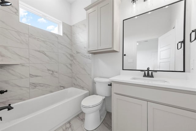 full bathroom featuring tiled shower / bath combo, vanity, and toilet