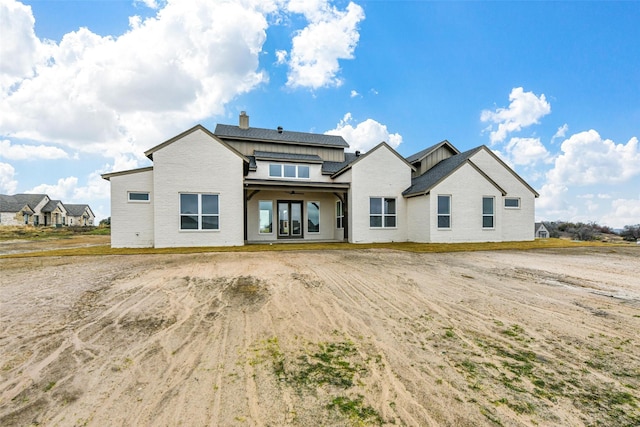 back of house featuring ceiling fan