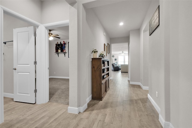 hall with light wood-type flooring