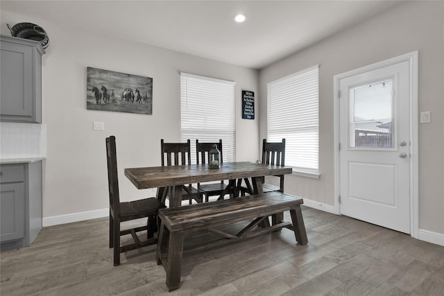 dining space featuring wood-type flooring