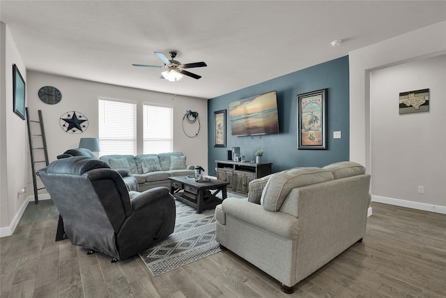 living room with hardwood / wood-style flooring and ceiling fan