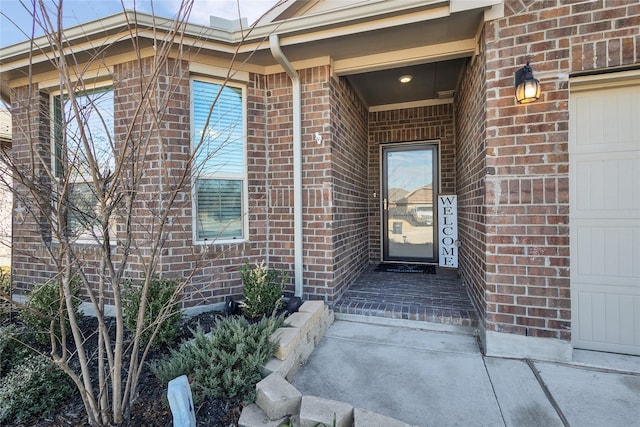 doorway to property featuring a garage