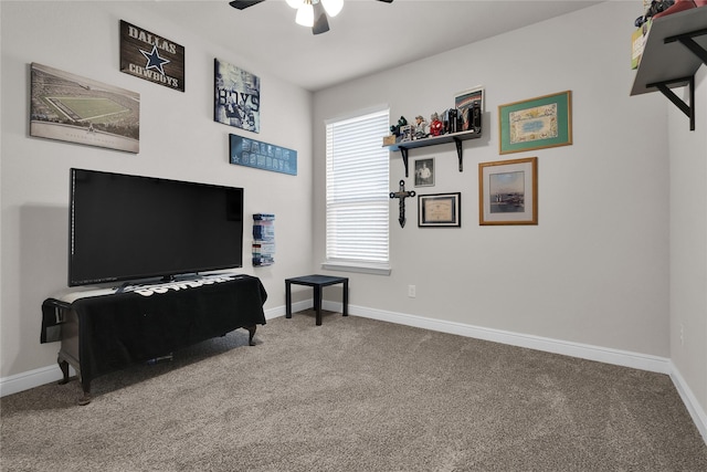 interior space with carpet floors and ceiling fan