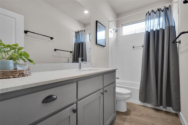 full bathroom with vanity, toilet, and shower / tub combo with curtain