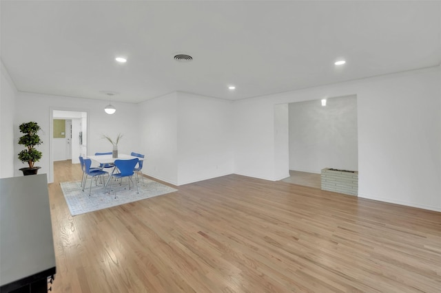 unfurnished living room featuring light hardwood / wood-style flooring