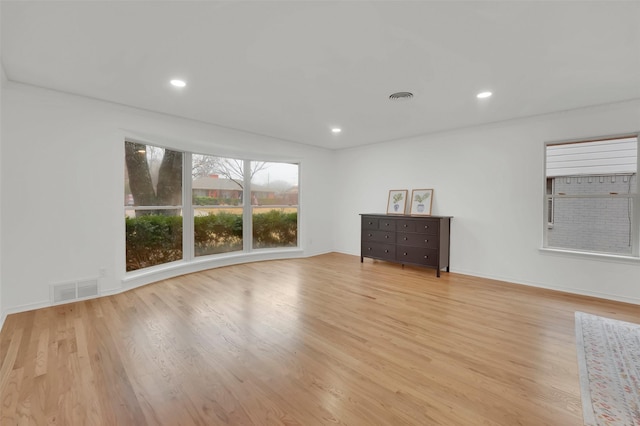 spare room featuring light hardwood / wood-style floors