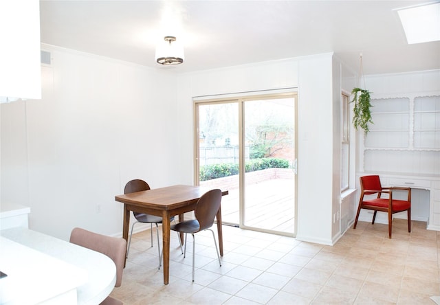 dining space featuring ornamental molding