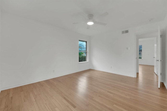 unfurnished room featuring ceiling fan and light hardwood / wood-style flooring