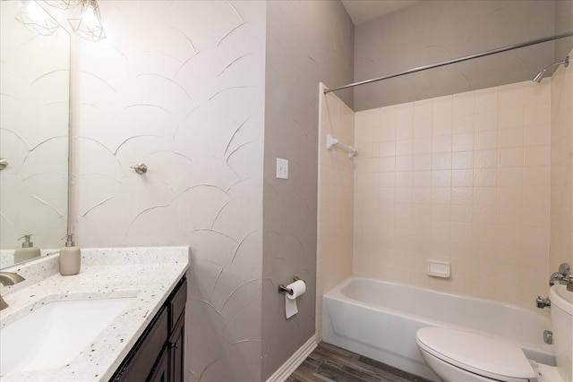 bathroom with shower / bath combination, baseboards, toilet, wood finished floors, and vanity