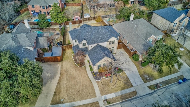 birds eye view of property with a residential view