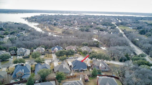 birds eye view of property featuring a water view and a residential view