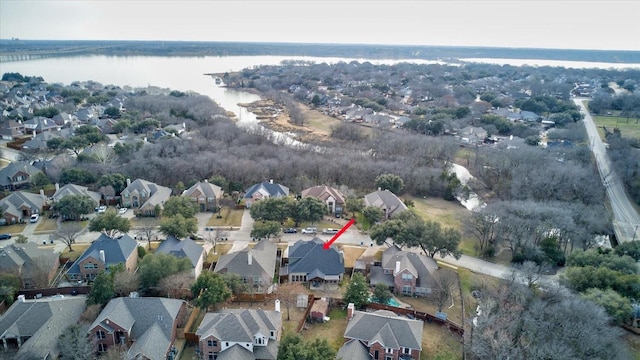 bird's eye view with a water view and a residential view