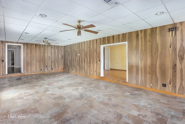 164 Ruth, Haughton, LA 71037 - unfurnished room featuring ceiling fan, a drop ceiling, and wood walls