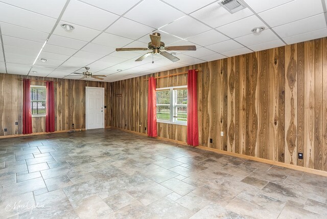 164 Ruth, Haughton, LA 71037 - unfurnished room with ceiling fan, a drop ceiling, and wood walls