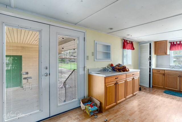164 Ruth, Haughton, LA 71037 - kitchen with french doors, sink, and light wood-type flooring