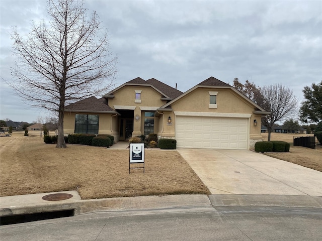 view of front of property with a garage