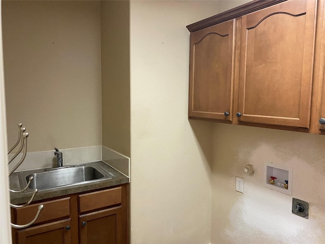 washroom with cabinets, electric dryer hookup, sink, and hookup for a washing machine