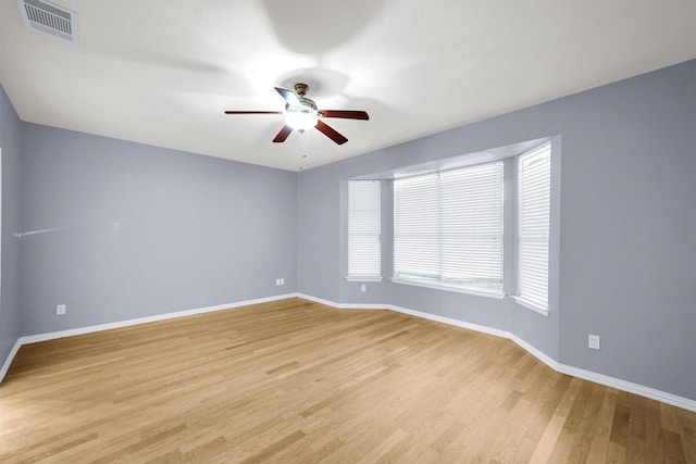 spare room featuring ceiling fan and light wood-type flooring