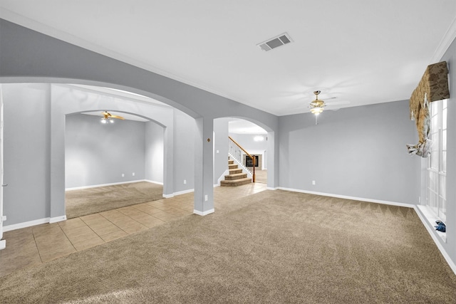 unfurnished living room featuring ceiling fan and carpet