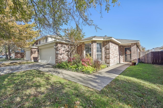 ranch-style home featuring a garage and a front yard