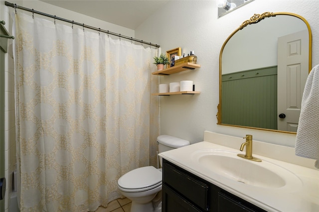 bathroom with a shower with curtain, vanity, tile patterned floors, and toilet