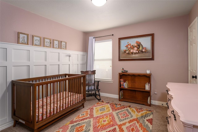 carpeted bedroom with a crib