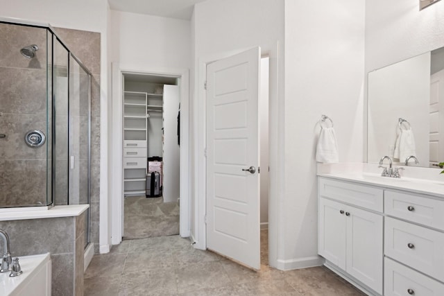 bathroom featuring an enclosed shower, vanity, and tile patterned floors