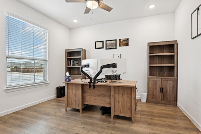 office area featuring wood-type flooring and ceiling fan